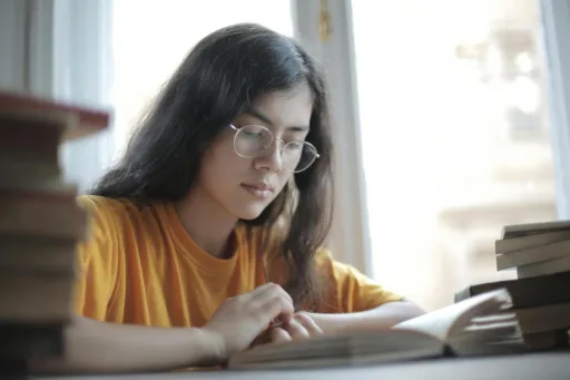 A woman sitting and studying